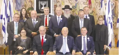  ?? (Marc Israel Sellem/The Jerusalem Post) ?? PRESIDENT REUVEN RIVLIN and party leaders pose yesterday for the opening of the 22nd Knesset.