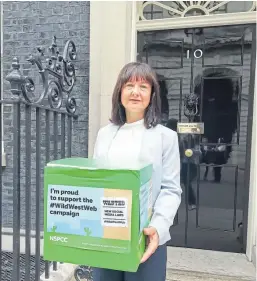  ??  ?? Ruth Moss at 10 Downing Street in July with a petition signed by almost 46,000 people.