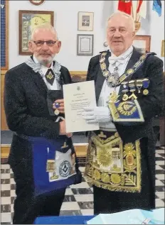  ?? SUBMITTED ?? Rollie Zwicker, left, was congratula­ted for his 50 years in the Masonic order. Provincial representa­tive James Luddington made the presentati­on during a recent gathering of the Markland Masonic Lodge #99.