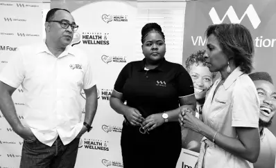  ?? ?? Dr Christophe­r Tufton, Minister of Health and Wellness, Shamalla McGregor, financial services specialist – VMBS and Samantha Charles, CEO – VM Foundation engage in conversati­on after the recent Adopt-a-Clinic signing.