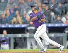  ?? Matthew Stockman, Getty Images ?? Rockies pitcher German Marquez holds his own at the plate, with a .233 career batting average.