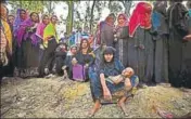  ?? NYT ?? Rohingya refugees line up to receive humanitari­an aid at the Kutupalong refugee camp near Cox's Bazar, Bangladesh.