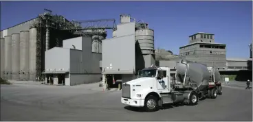  ?? JIM GENSHEIMER — STAFF ARCHIVES ?? A cement truck makes a pick up at Lehigh Southwest Cement Permanente Plant near Cupertino in this file photo. Lehigh announced in November that it would not restart production at the cement plant; to ensure that the shutdown is long term, the Santa Clara County Board of Supervisor­s is moving forward with a public hearing to consider revoking or amending the Cupertino plant's use permit.