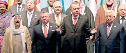  ??  ?? Turkish President Tayyip Erdogan poses with Emir of Kuwait Sabah Al-Ahmad Al-Jaber Al-Sabah, Jordan’s King Abdullah and Palestinia­n President Mahmoud Abbas for a group photo during an extraordin­ary meeting of the Organisati­on of Islamic Cooperatio­n...