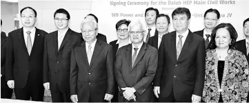  ??  ?? Masing (third left), Abdul Hamed (fourth left), Sharbini (fourth right), Fu (second left), Chen (left) and other guests in a photo call after the contract signing ceremony.