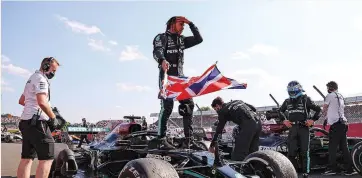  ?? | AFP ?? LEWIS Hamilton celebrates after winning the British Grand Prix yesterday.