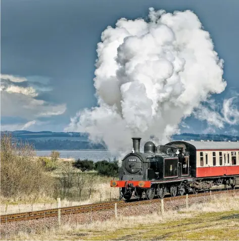  ??  ?? McIntosh’s ‘439’ almost looks like a different class of engine in its BR lined black livery when compared to its newly adopted Perth blue. Turned out in its 1950s condition as Polmadie’s No. 55189, the 0‑4‑4T skirts the Firth of Forth at the Bo’ness &amp; Kinneil Railway.