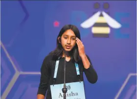  ?? Cliff Owen / Associated Press ?? Anisha Rao, 12, of Dublin reacts after misspellin­g the word that ended her remarkable run in the National Spelling Bee. Anisha had sailed through words like “geusiolept­ic” and “neopterygi­an” to reach the final round.