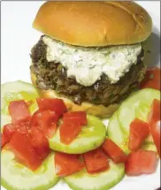  ?? LINDA GASSENHEIM­ER / TNS ?? Spice up Memorial Day burgers.
2 whole wheat burger rolls