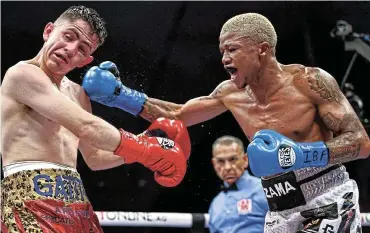  ?? Picture: Melina Pizano/Matchroom. ?? Sivenathi Nontshinga lands a punch on Adrian Curiel on his way to winning the IBF world junior-flyweight title at the Guelaguetz­a Auditorium in Oaxaca, Mexico, on Friday night.