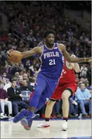  ?? RICH SCHULTZ — THE ASSOCIATED PRESS ?? 76ers center Joel Embiid (21) in action against the Raptors in Philadelph­ia, Monday.