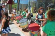  ?? FILE PHOTO ?? The Troy Samba group prepares for its performanc­e at a past River Fest.