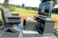  ?? Picture: Veli Nhlapo ?? Khitsane’s elaborate tombstone for Joe Mafela. The granite installati­on includes a couch, coffee table and flat-screen TV.