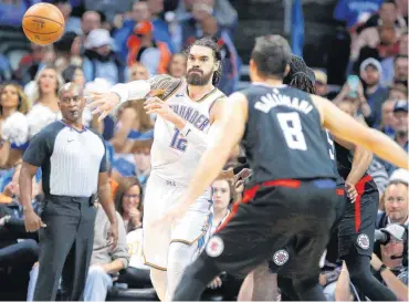  ?? [PHOTO BY BRYAN TERRY, THE OKLAHOMAN ARCHIVES] ?? Oklahoma City Thunder’s Steven Adams passes the ball against the Los Angeles Clippers in December.