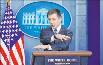  ?? Susan Walsh The Associated Press ?? Transporta­tion Secretary Pete Buttigieg speaks during the daily briefing at the White House in Washington on Monday. Congress has created a new requiremen­t for automakers: Find a high-tech way to keep drunken people from driving cars.