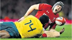  ??  ?? Pain game: Jonathan Davies suffers an ankle injury in the final play of the match