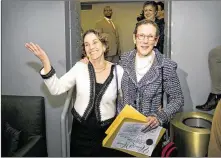  ?? JAY JANNER / AMERICANST­ATESMAN ?? Suzanne Bryant (left) and Sarah Goodfriend arrive at their party at the Highland Lounge in Austin in February after becoming the first legally married gay couple in Texas.