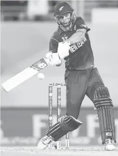  ??  ?? New Zealand’s Grant Elliot hits a shot for six runs to win their Cricket World Cup semi-final match against South Africa in Auckland in this March 24 file photo. — Reuters photo