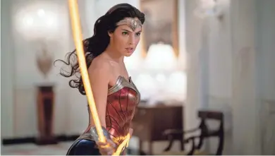  ?? CLAY ENOS/WARNER BROS. ?? Gal Gadot has things in hand as the title superhero in “Wonder Woman 1984.”