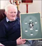 ?? Photo Michelle Cooper Galvin ?? Ned Spillane from Glenflesk with the empty frame that held his Grandfathe­r’s medals which were stolen.