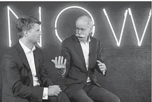  ?? AP/BERND VON JUTRCZENKA ?? Harald Krueger, (left) CEO of BMW, and Dieter Zetsche, Daimler’s CEO, hold a news conference in Berlin.