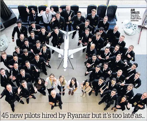  ??  ?? AIR SMILES New pilots at Ryanair’s Dublin offices yesterday
