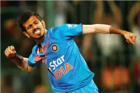  ??  ?? Pleased as punch: Yuzvendra Chahal celebrates Joe Root’s dismissal