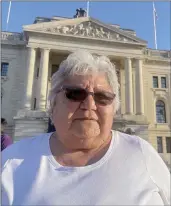  ?? The Canadian Press ?? Marie-Anne Day Walker-Pelletier poses in front of the Saskatchew­an legislatur­e in Regina on Tuesday.