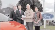  ??  ?? Philip Lewis receiving the keys to his 30th new Ford car purchased through Cavanagh's of Charlevill­e. Included are Philip Lewis and his daughter Martina from Cloyne, Co.Cork, Eddie Murphy CEO Ford Ireland and Hugh Sheehy Marketing Manager from...