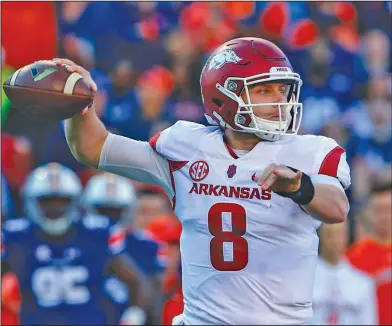  ?? Associated Press ?? Hog caller: Arkansas quarterbac­k Austin Allen (8) throws a pass against Auburn. After a successful first season as the starting quarterbac­k at Arkansas for Austin Allen, the senior enters this season with a resume equal to nearly any other signal...