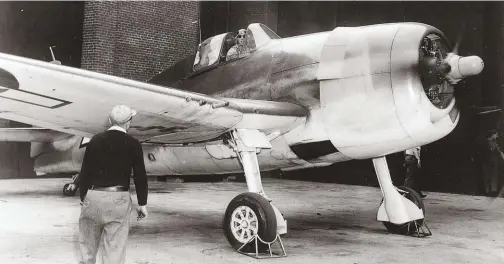  ??  ?? This Hellcat F6F-3 Bu. No. 25881 was the prototype F6F-5 that Grumman flew for many performanc­e tests and to which it made numerous aileron changes to improve roll performanc­e. You can see the full-vision sliding canopy and windshield that were part of the improvemen­t program. The author is in the cockpit. (Photo courtesy of Grumman)