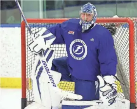  ?? PROVIDED PHOTO BY DIRK SHADD/TAMPA BAY TIMES ?? Tampa Bay Lightning goaltender Jonas Johansson takes a knee in the net while on the ice for the first day of the training camp at the TGH Ice Plex on Sept. 21 in Brandon.