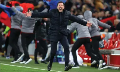  ??  ?? Diego Simeone, the Atlético Madrid manager celebrates his side’s second goal at Anfield. Photograph: Julian Finney/Getty Images