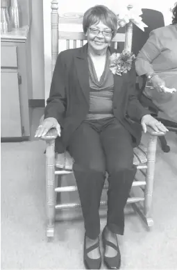  ?? Staff photo by Jennifer Middleton ?? ■ Miller County Tax Assessor Mary Stuart sits in a rocking chair she received Thursday during her retirement party, held on the third floor of the courthouse. She is retiring after 38 years of service to the county, 22 of them as tax assessor.