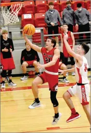  ?? Enterprise-Leader photograph by Mark Humphrey ?? Pea Ridge senior Greydon Edwards scores a layup during the Blackhawks’ 64-63 win in a boys basketball contest on Tuesday, Jan. 12 at Cardinal Arena.