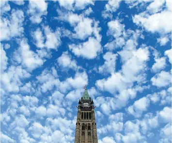  ?? SEAN KILPATRICK/CP FILES ?? The Peace Tower is seen on Parliament Hill in this file photo. An opposition filibuster in a House of Commons committee meant to prevent the Liberals from passing a motion that would impose a deadline on their study of proposed changes to the way the...