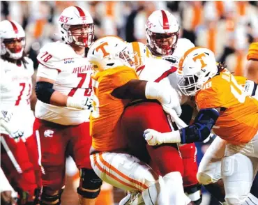  ?? TENNESSEE ATHLETICS PHOTO BY ANDREW FERGUSON ?? Tennessee defensive linemen Da’Jon Terry (95) and Ja’Quain Blakely (48) wrap up South Alabama quarterbac­k Desmond Trotter last Saturday night in Neyland Stadium. Blakely will play his final home game for the Volunteers this weekend against Vanderbilt.