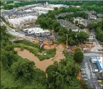  ?? HYOSUB SHIN/HYOSUB. SHIN@AJC.COM 2022 ?? An aerial photo shows the constructi­on area where the bridge along Cheshire Bridge Road, which crosses over Peachtree Creek, was demolished after a fire on Aug. 4, 2021.