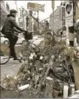  ?? AFP ?? Flowers mark the location where a man crashed a truck into people walking and cycling along a Manhattan bike path