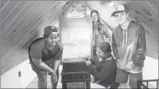  ?? AETHNE HINCHLIFFE ?? Malachi Sampson, Trinity States, Erica MacNeil and Jack Smith, from Windsor, N.S., climb to the top of the lighthouse to see the view and try the foghorn.