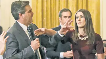  ??  ?? CNN is suing President Trump over revoking Jim Acosta’s White House press pass after he refused to give up the mic to an intern during a testy exchange with Trump. DO THE TUSSLE: