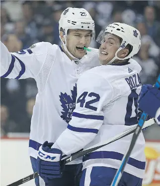  ?? KEVIN KING ?? James van Riemsdyk celebrates his goal with Maple Leafs teammate Tyler Bozak en route to dismantlin­g the Jets in Winnipeg, Wednesday.