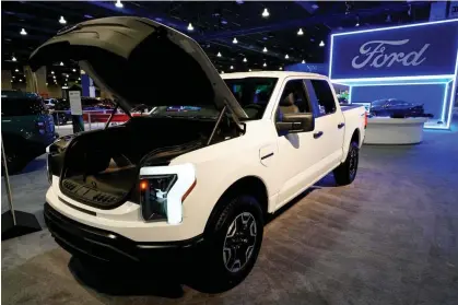  ?? ?? Ford says it ‘expects to offer’ hybrid versions of all of its gas-powered vehicles by the end of decade in the US. Photograph: Matt Rourke/AP