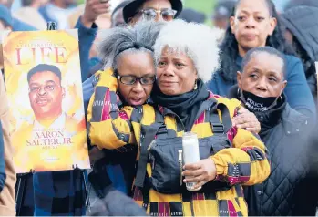  ?? SCOTT OLSON/GETTY ?? People attend a vigil Tuesday in Buffalo, N.Y., to remember 10 Black people killed last week at a market.