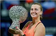  ?? AP ?? Petra Kvitova poses with the winners trophy after defeating Elina Svitolina in the WTA Elite Trophy tournament in China. —