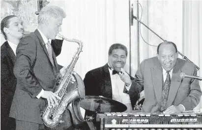  ?? RUTH FREMSON/AP ?? Jazz legend Lionel Hampton, right, performs with President Bill Clinton on the saxophone in the East Room of the White House during a celebratio­n in honor of Hampton’s 90th birthday on July 23, 1998.