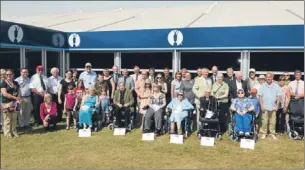  ??  ?? The wheelchair recipients and members of the Keepers of the Green.