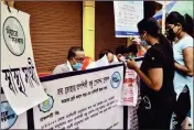  ?? FILE PIC ?? People queue up to register for one of the state government’s social security schemes, Swasthya Sathi