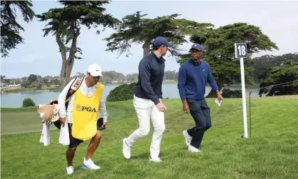  ??  ?? Tiger Woods (right) shot a 68 on the first day of the US PGA Championsh­ip – the best round of his playing group which included Rory McIlroy and the world No 1, Justin Thomas. Photograph: Sean M Haffey/Getty Images