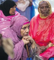  ??  ?? The Somali-Canadian community and the Hintonburg neighbourh­ood gathered just steps away from 55 Hilda St., where Abdi died.